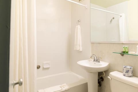 Basic Single Room, 1 Queen Bed | Bathroom | Combined shower/tub, deep soaking tub, free toiletries, towels