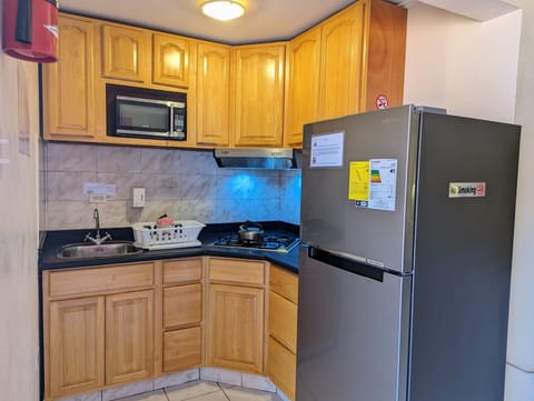 Standard Studio, 1 King Bed | Private kitchen | Fridge, microwave, stovetop, coffee/tea maker