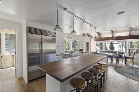 Fully stocked kitchen and island for group cooking.