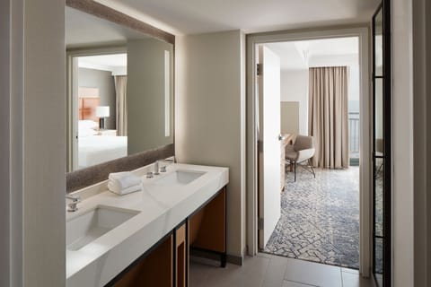 Suite, 1 Bedroom, Balcony, Pool View | Bathroom | Combined shower/tub, eco-friendly toiletries, hair dryer, bathrobes