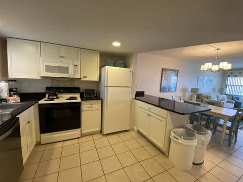 Partial Gulf View Condo 307 | Private kitchen | Full-size fridge, microwave, oven, stovetop