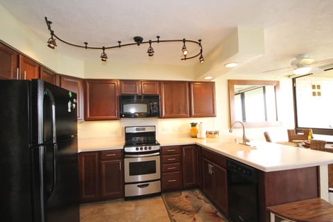 Full kitchen with refrigerator, oven, microwave, and dishwasher.