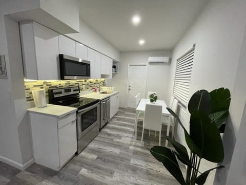 Family Apartment | Private kitchen | Full-size fridge, microwave, toaster, cookware/dishes/utensils