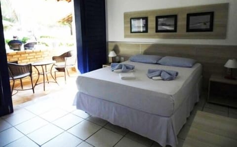 Standard Double Room, Patio, Ground Floor | Desk, bed sheets