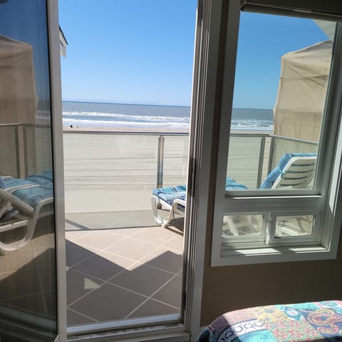 Patio on the second floor off of the bedroom on the right with two twin beds