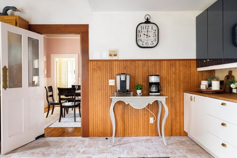 Fully stocked coffee bar off kitchen.