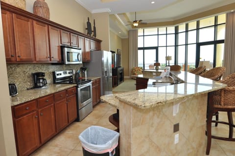 Condo, 4 Bedrooms | Private kitchen | Fridge, oven, coffee/tea maker