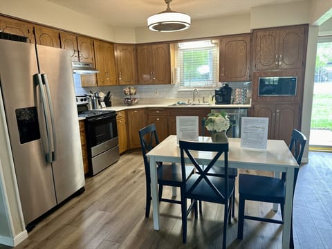 Kitchen has eat-in dining 4-top table. Additional dining/table seating in garage