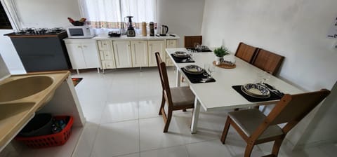 Executive Apartment | Private kitchen | Fridge, microwave, cookware/dishes/utensils