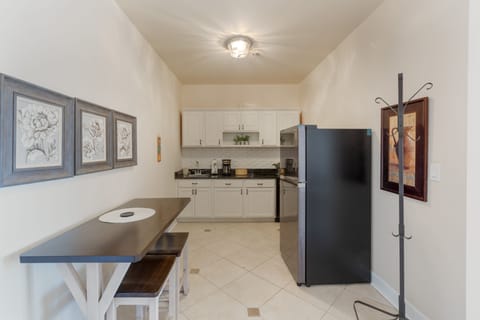 The kitchenette is equipped with granite countertops, a Keurig coffee maker, toaster, microwave, and refrigerator.