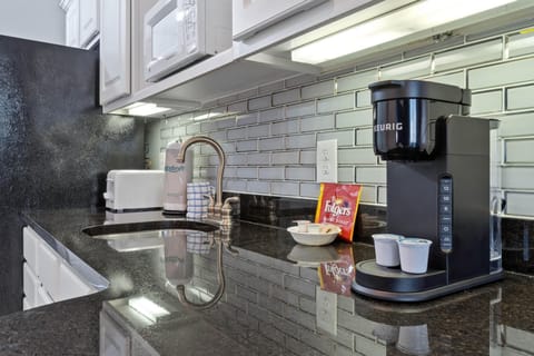 Kitchenette with seating area and full size refrigerator