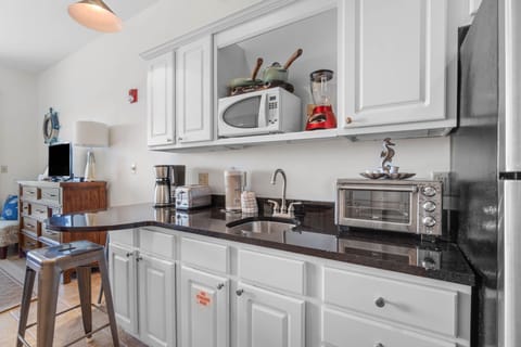 Kitchenette area with microwave and full size refrigerator