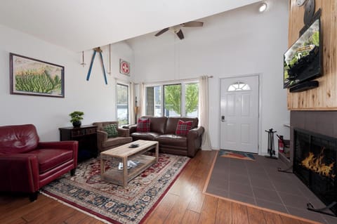 Main Living Space - TV and wood burning fireplace