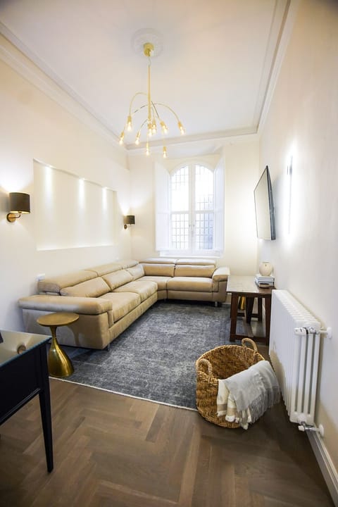 Brand new sofa-bed which pulls out to a bed that is 140cm x 195cm & 65" TV.