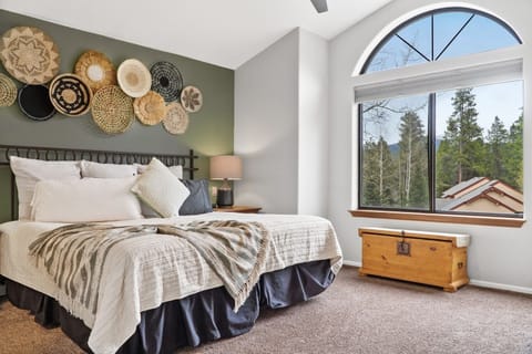 Our large Master Suite boasts a King Bed and 5 piece attached ensuite bathroom. It also has a desk and work area, as well as a TV.