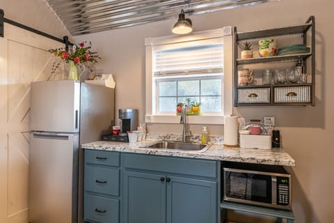 Kitchenette with keurig coffee maker, microwave, and apt size fridge