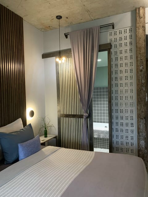 Luxury Double Room | Bathroom | Deep soaking tub, designer toiletries, hair dryer, slippers