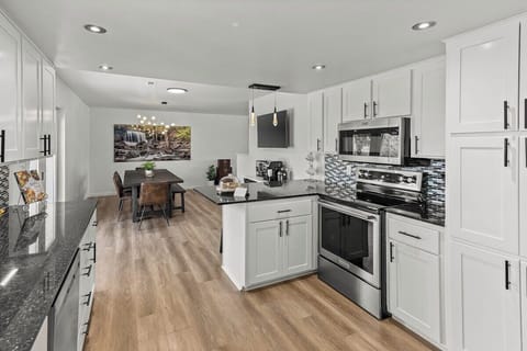 KITCHEN | New major appliances and essential small appliances will help the COZY OZ feel like home.  In addition to white porcelain place settings and glassware, we offer a break resistant set for the patio, jacuzzi, and "accident prone" guests.