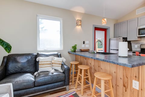 A modern kitchen and living space perfect for small groups.