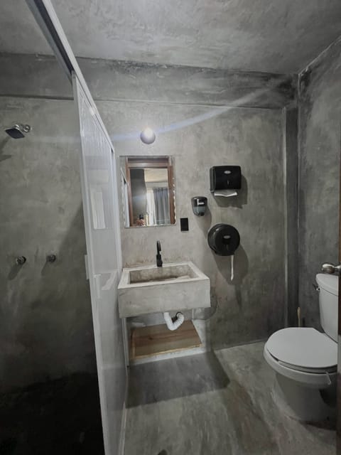 Deluxe Shared Dormitory, Mixed Dorm, Beach View | Bathroom | Shower, rainfall showerhead, toilet paper