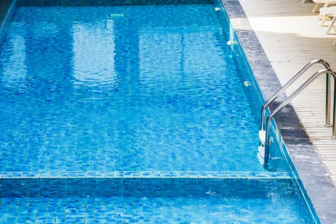 Outdoor pool, pool umbrellas, sun loungers