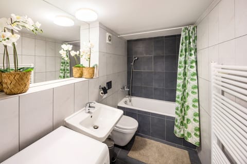 Comfort Apartment | Bathroom | Bathtub, deep soaking tub, hair dryer, towels