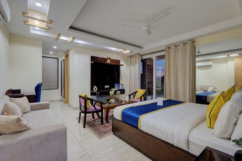 Premium Room with Balcony | In-room safe, desk, laptop workspace, blackout drapes