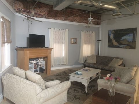 Apartment D: Riverfront Grand | Living area | 42-inch Smart TV with digital channels, TV, Netflix
