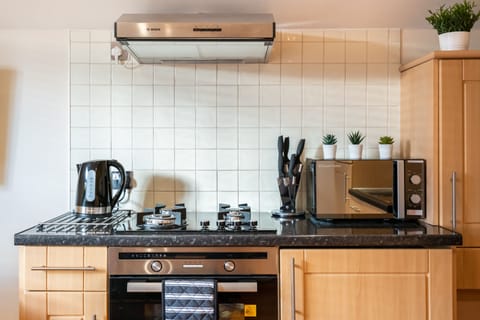 Deluxe Apartment | Private kitchen | Full-size fridge, microwave, oven, dishwasher