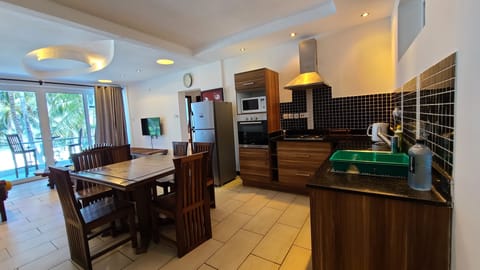 Apartment, 3 Bedrooms | Private kitchen | Full-size fridge, microwave, oven, toaster