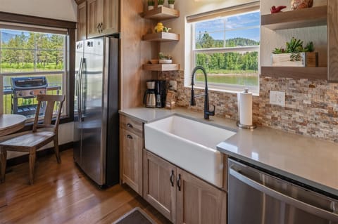 Well appointed kitchen with a farm house sink