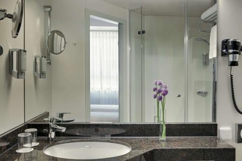 Shower, eco-friendly toiletries, hair dryer, towels