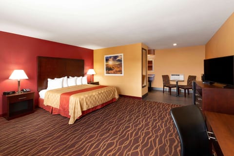 Suite, 1 King Bed, Non Smoking | 1 bedroom, desk, blackout drapes, iron/ironing board