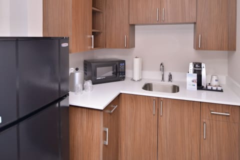 Suite, 1 King Bed | Private kitchen | Fridge, microwave, coffee/tea maker