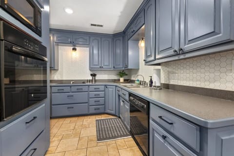 To the left of the bar area, sits our large, L-shaped kitchen.