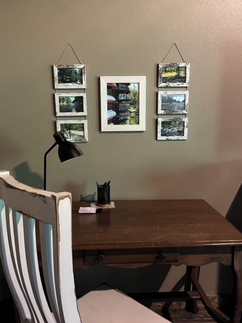 Work Space with desk and chair and Caddo River photos