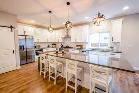 The kitchen is fully equipped with brand-new stainless-steel appliances