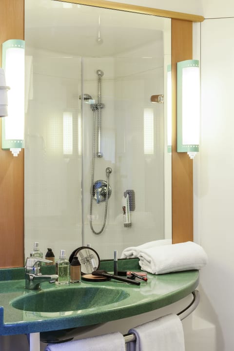 Shower, eco-friendly toiletries, hair dryer, towels