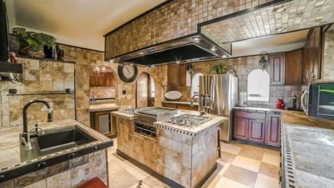 Large kitchen with plenty of space to gather in while cooking and baking family favorites. This culinary sanctuary is a haven for gastronomic adventures...