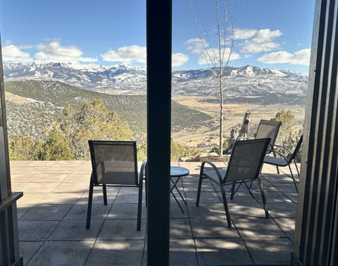 Enjoy the gorgeous view from the patio. Six chairs and tables for you wine glass