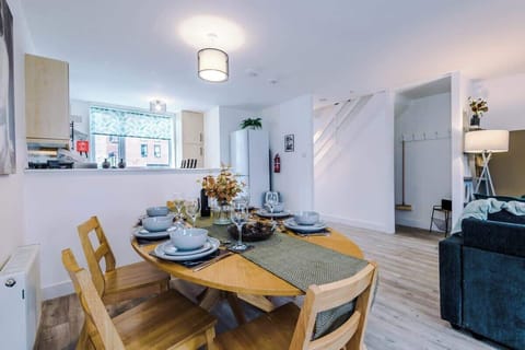 The open-plan dining area has space for 8 people to sit around the table.