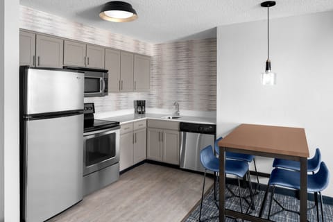 Suite, 2 Bedrooms | Private kitchen | Full-size fridge, microwave, stovetop, dishwasher
