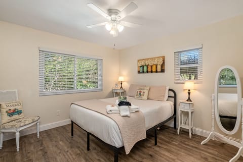 Queen Bedroom offering a private bath with a simple close of a door