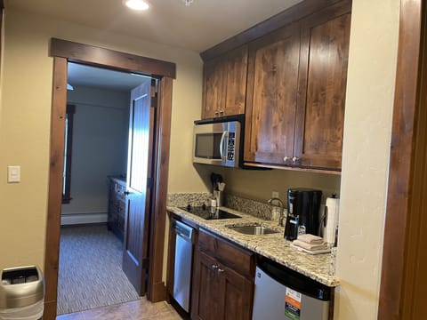 Suite kitchenette leading into bedroom 