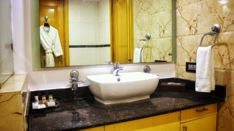 Suite | Bathroom | Designer toiletries, hair dryer, bathrobes, slippers