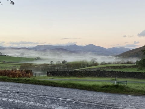 View from the village green opposite the house of the Coniston mountain range