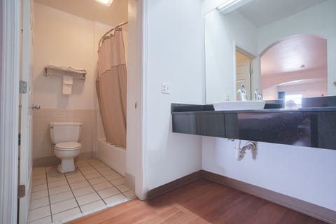 Deluxe Room, 2 Queen Beds | Bathroom | Jetted tub, free toiletries, hair dryer, towels
