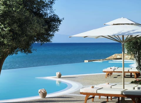 Outdoor pool, an infinity pool, pool umbrellas