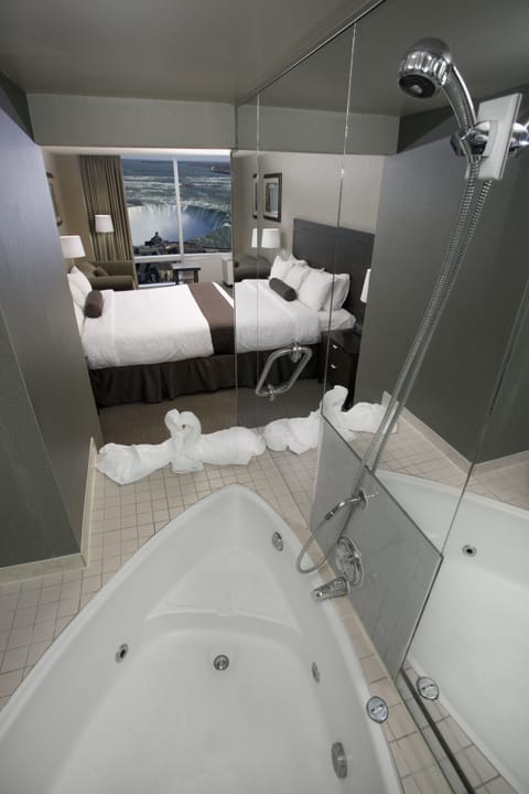 Tower Room Falls View One King Heart-shaped Jacuzzi room | Bathroom | Designer toiletries, hair dryer, towels, soap