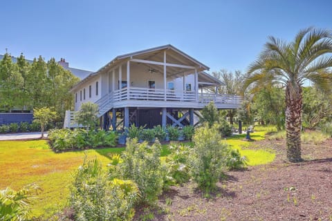 Experience this gorgeous beach home just steps from the sand and salt water.
